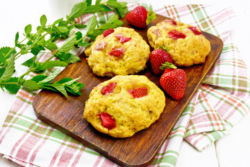 Scones with strawberry on board