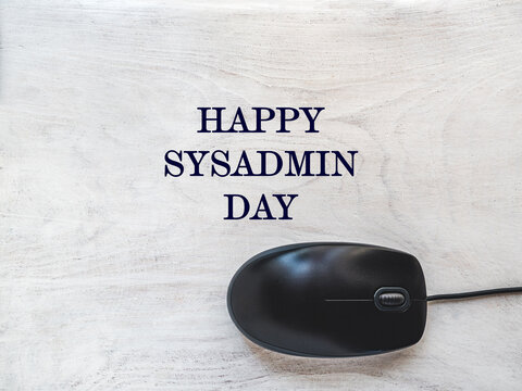 Happy Sysadmin Day. Beautiful greeting card. Close-up, view from above. Preparation for a professional holiday. Congratulations for family, relatives, friends and colleagues