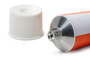 Sealed white with red tube of ointment and cap on a white background. Full depth of field. With clipping path