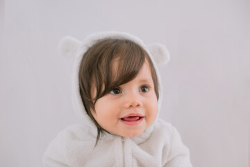 Cute baby with fluffy hair. Pretty boy.