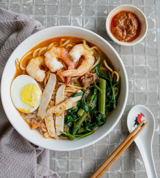 Homemade soup noodle meal / Spicy Prawn Noodle / A popular street food made famous by the Hokkien Chinese in Malaysia and Singapore