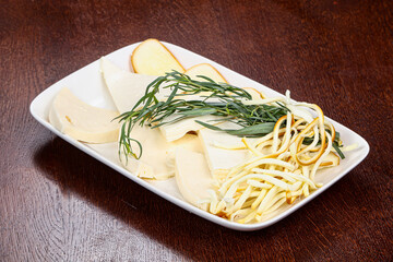 Caucasian tradition cheese plate served herbs