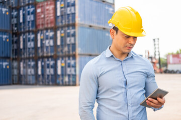 Caucasian men freight supervisor inspect the condition of all containers shipment by using tablet to record data and taking on smartphone. People and worker in freight deliver, import and export.