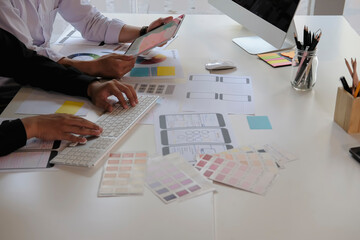 Web designer meeting  planning application for mobile phone. Design Online Technology Content,...