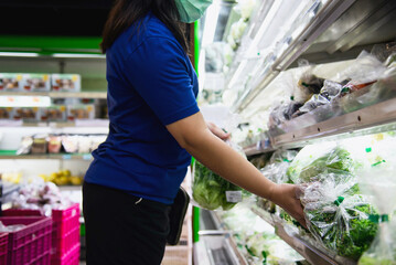 Woman shopping fresh vegetable during COVID-19 spreading in Chiang Mai Thailand local supermarket