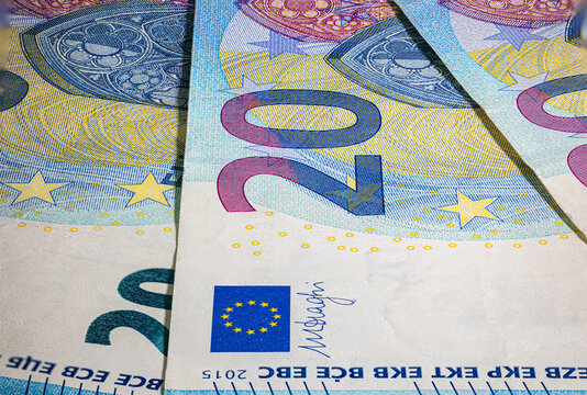 Twenty Euro banknote fragment macro. Closeup photo of a part of the new twenty euro note. Money of the European Union. Europe currency. Intaglio printed denomination. Detailed concept euro design.