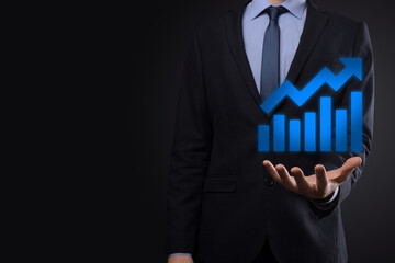 Businessman hold drawing on screen growing graph, arrow of positive growth icon.pointing at creative business chart with upward arrows.Financial, business growth concept