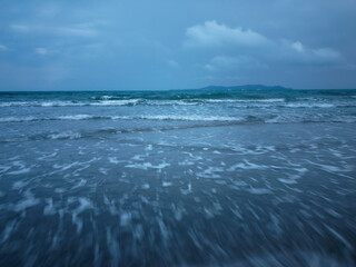 A beautiful view of a sandy beach under a cloudy sky