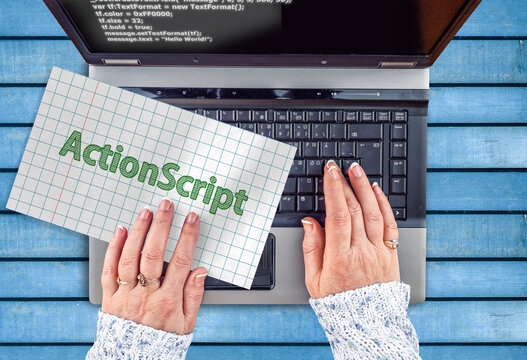 ActionScript Programming Language. Word ActionScript on paper and laptop
