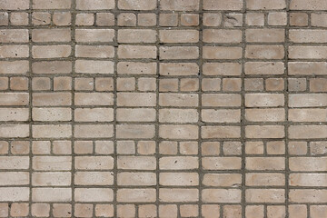 Texture of a lined brick wall.