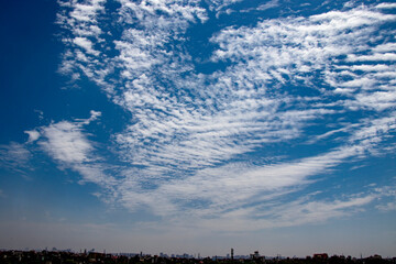 Fototapeta na wymiar Dramatic Sky Background. Clouds in blue Sky. Moody Cloudscape. Panoramic Image Can Be Used as Web Banner