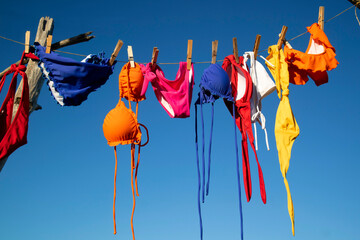 Female swimwear hanging in the sun to dry