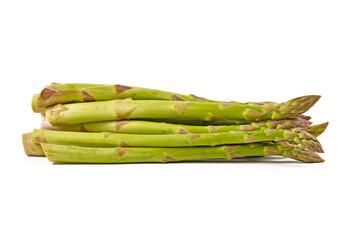 Side view of bunch of raw green asparagus vegetables isolated on white background