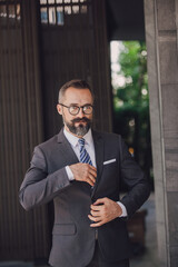 Portrait of businessman with standing in office