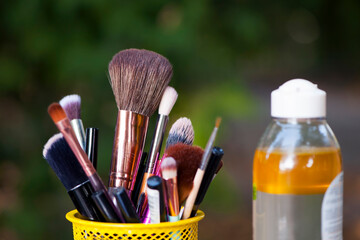 set for cosmetic brushes in the basket. Blush for eyeshadow and various makeup brushes in the shopping cart. Beauty concept, online shopping of decorative cosmetics, discounts in stores