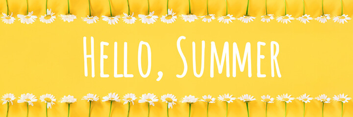 Hello Summer text and border from chamomile flowers on yellow background. Concept Welcome summer time. Banner