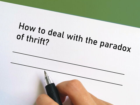 One person is answering question about banking. He is thinking how to deal with the paradox of thrift.