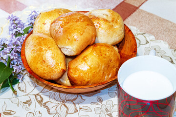 Homemade pastries. Delicious close-up pies and a glass of milk.