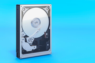 Hard Disk Drive HDD on blue backdrop, 3D rendering