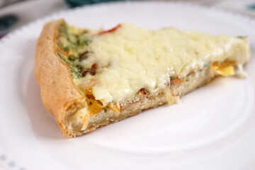 Kish. Homemade pie with scrambled eggs, vegetables and cheese.