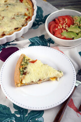 Kish. Homemade pie with scrambled eggs, vegetables and cheese.
