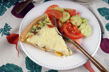 Kish. Homemade pie with scrambled eggs, vegetables and cheese.