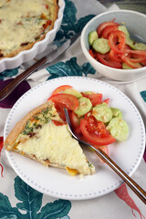 Kish. Homemade pie with scrambled eggs, vegetables and cheese.