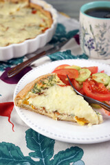 Kish. Homemade pie with scrambled eggs, vegetables and cheese.