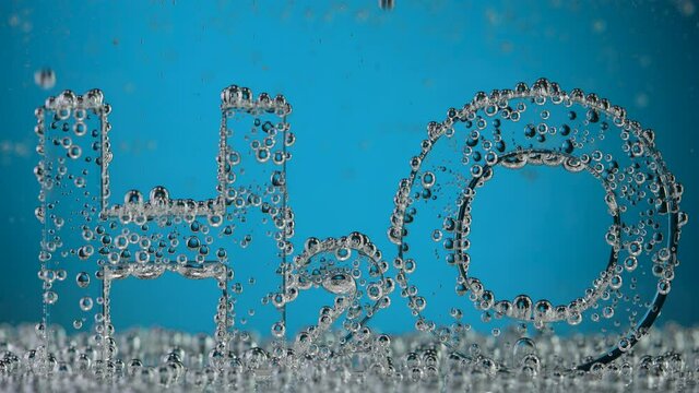 Water chemical formula H2O on blue background.