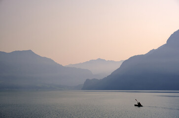 Kayakker and mountains, Brienzersee, Berner Oberland, Switzerland