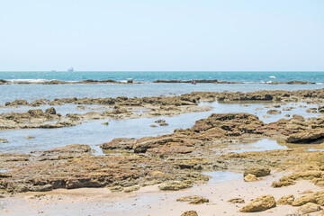 Shore of stones and sand on an Andalusian beach, Spain