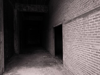 The brick walls of the old abandoned buildings are scary.
