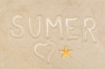 Fototapeta na wymiar Word Summer written on the sand.