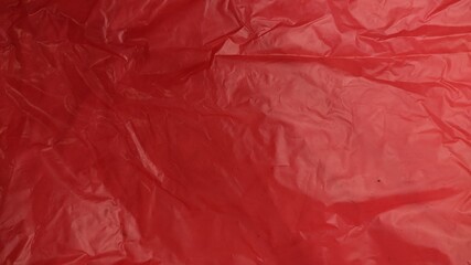 Fototapeta premium A Red Plastic Bag Texture for background, Plastic crumpled texture
