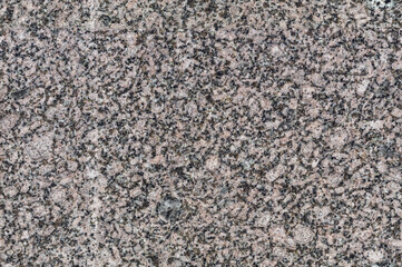 seamless mottled gray and beige granite texture with dark blue splashes. stone surface