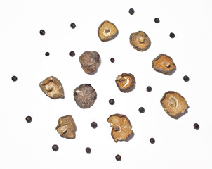 Dried shiitake mushrooms with juniper.
