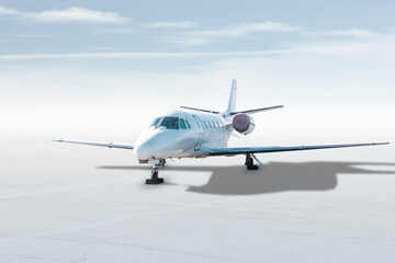 Modern white corporate business jet isolated on bright background with sky