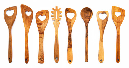 Various heart shape of wooden cooking utensils. Wooden spoons and wooden spatula isolate on white...
