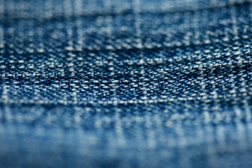 Jeans denim texture close up , focus only one point , soft blured background wallpaper