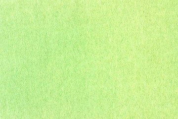 Naklejka na ściany i meble A sheet of green colored paper. Rough smooth texture.