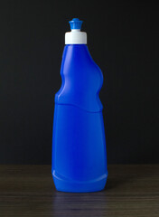 lue plastic bottle on a dark background.