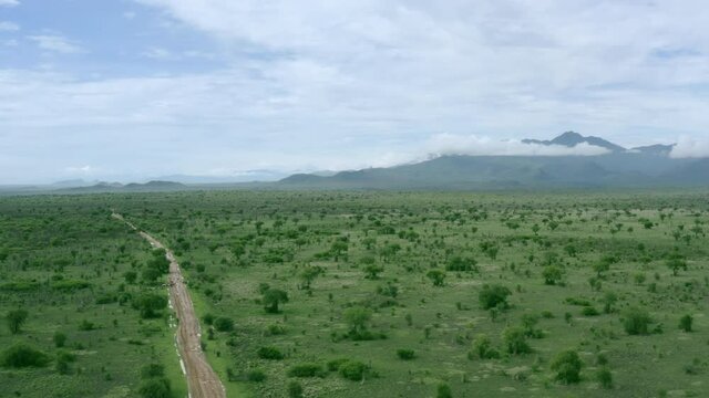 Aerial view road in green savanna landscape. Drone video of the Omo Valley in Ethiopia Africa.