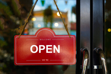 red label open closed sign on glass door is open for welcome customers to the coffee shop