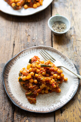 Chickpea with tomatoes, onion and courgette