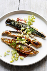 Grilled mackerel with gooseberry chutney and pickled cucumber