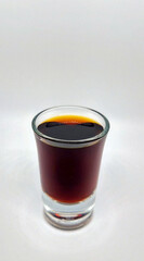 Close up of a jager shot glass on white background