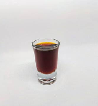 Close up of a jager shot glass on white background