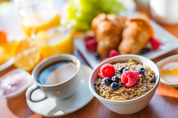 Breakfast served with coffee, orange juice, croissants, cereals