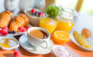 Breakfast served with coffee, orange juice, croissants, cereals