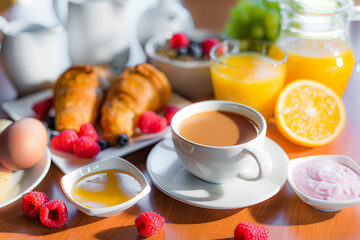 Breakfast served with coffee, orange juice, croissants, cereals